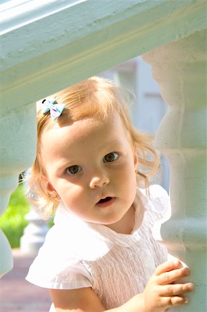 fastof (artist) - The little girl in a white dress with curiosity looks out Stock Photo - Budget Royalty-Free & Subscription, Code: 400-04741693