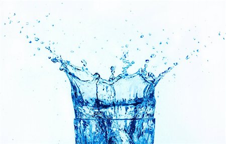 blue water splashing on glass, isolated on white background. Stock Photo - Budget Royalty-Free & Subscription, Code: 400-04742010