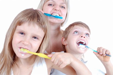 pictures of girls brushing blonde hair - three people  cleaning  teeth over white background Stock Photo - Budget Royalty-Free & Subscription, Code: 400-04742038