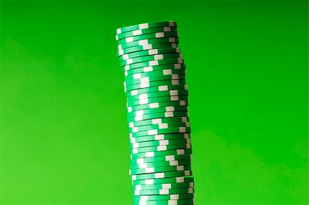 simsearch:400-05081220,k - Stack of casino chips against green background Foto de stock - Super Valor sin royalties y Suscripción, Código: 400-04742195