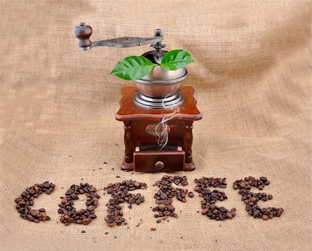 vintage coffee grinder and sign coffe from coffee granules with coffee plant Stock Photo - Budget Royalty-Free & Subscription, Code: 400-04742978