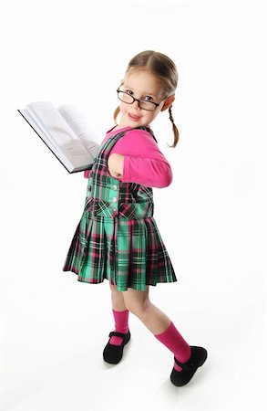 simsearch:400-04131892,k - Cute preschool age girl wearing eyeglasses holding a and reading a book Stockbilder - Microstock & Abonnement, Bildnummer: 400-04743458