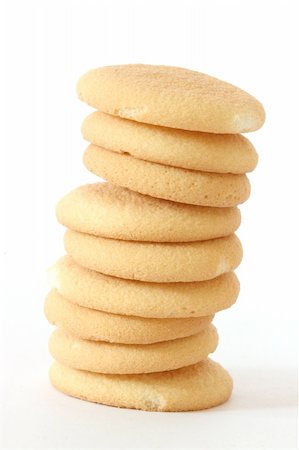 sablé (gâteau) - Close up view of several sponge biscuits in a stack on white background Photographie de stock - Aubaine LD & Abonnement, Code: 400-04743503