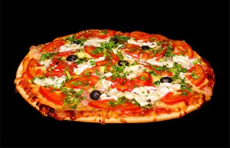 pizza with black background - cooking pizza with tomatoes and greens on black Stock Photo - Budget Royalty-Free & Subscription, Code: 400-04754668