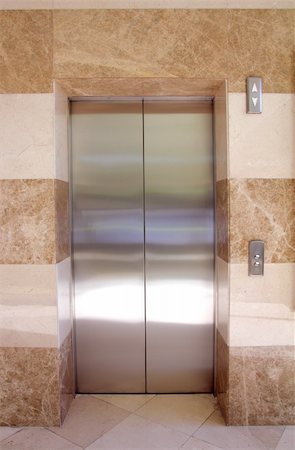 pushing door - empty contemporary interior with elevator steel doors Stock Photo - Budget Royalty-Free & Subscription, Code: 400-04754691
