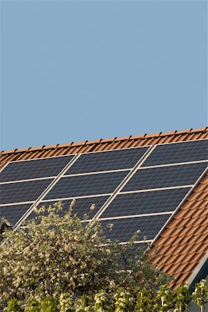 raphtong (artist) - solar or photovoltaic panels on a roof Fotografie stock - Microstock e Abbonamento, Codice: 400-04754816