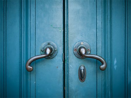 Door handles with an old double door painted with blue Stock Photo - Budget Royalty-Free & Subscription, Code: 400-04755793