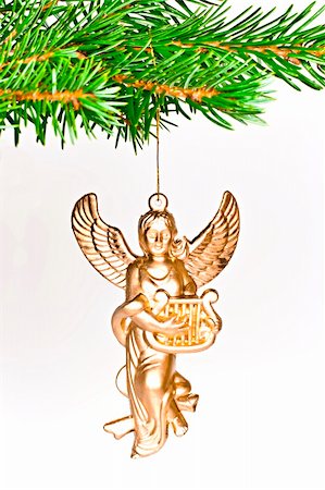 Christmas decoration angel on spruce branch. Isolated on a white background. Fotografie stock - Microstock e Abbonamento, Codice: 400-04756113