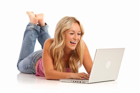 Portrait of casual young girl with jeans laying on floor with laptop Photographie de stock - Aubaine LD & Abonnement, Code: 400-04756146