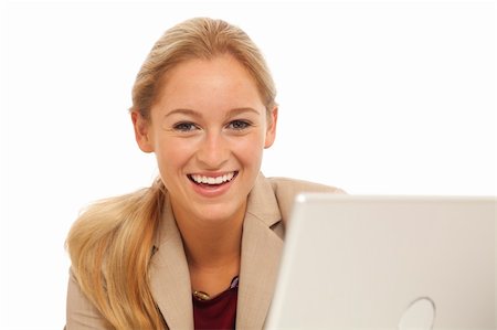 simsearch:400-05732500,k - Portrait of young business girl sitting at desk with laptop Foto de stock - Royalty-Free Super Valor e Assinatura, Número: 400-04756167