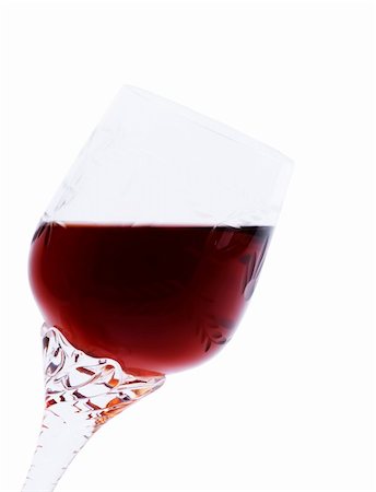 Red wine in an elegant glass inclined at a small angle. It is isolated on a white background.Hand made clipping path inside Foto de stock - Royalty-Free Super Valor e Assinatura, Número: 400-04756442