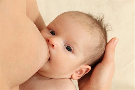 simsearch:400-04563710,k - Mother breastfeeding her newborn baby Foto de stock - Royalty-Free Super Valor e Assinatura, Número: 400-04756457