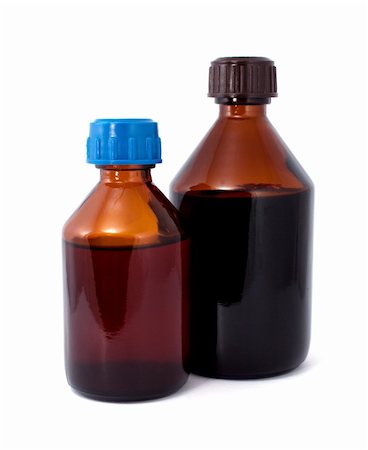 Two Brown bottles isolated over white background Stock Photo - Budget Royalty-Free & Subscription, Code: 400-04756520