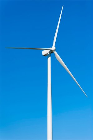 simsearch:400-04024418,k - Wind Turbine on Clear Blue Sky Fotografie stock - Microstock e Abbonamento, Codice: 400-04756697