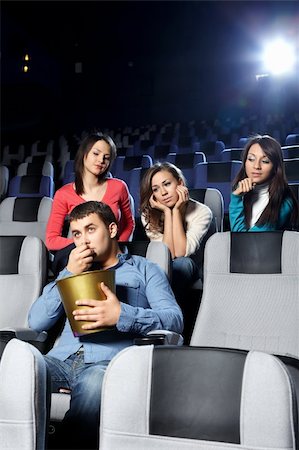 Enamoured girls admire the attractive man at cinema Stock Photo - Budget Royalty-Free & Subscription, Code: 400-04756937