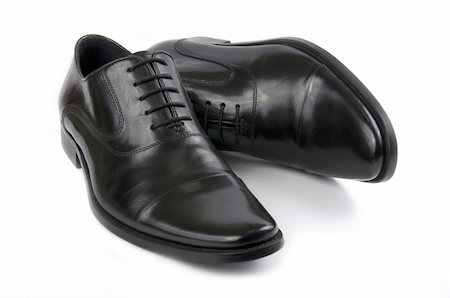 simsearch:400-04757041,k - Pair of black leather shoes on a white background Photographie de stock - Aubaine LD & Abonnement, Code: 400-04757041