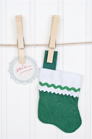 socks hanging clothesline - Holiday Sale Concept with Sale Tag Hanging on a Clothesline. Stock Photo - Budget Royalty-Free & Subscription, Code: 400-04757464