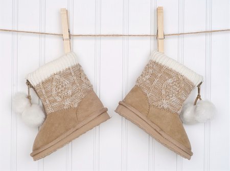 Pair of Winter Boots Hanging from a Clothesline. Stock Photo - Budget Royalty-Free & Subscription, Code: 400-04757461