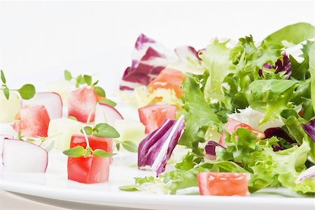 simsearch:400-04879197,k - Various salad leaves with tomato, radish and cucumber Stock Photo - Budget Royalty-Free & Subscription, Code: 400-04758135