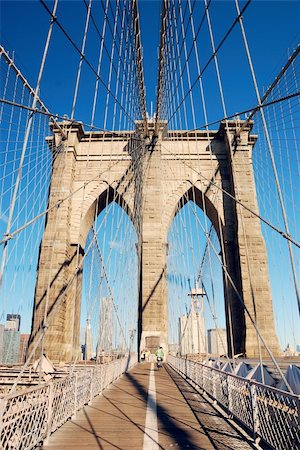 simsearch:6119-08062341,k - New York City Brooklyn Bridge in Manhattan closeup with skyscrapers and city skyline over Hudson River. Photographie de stock - Aubaine LD & Abonnement, Code: 400-04758377