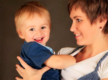simsearch:400-04535025,k - Picture of happy mother with baby in studio Stock Photo - Budget Royalty-Free & Subscription, Code: 400-04758487