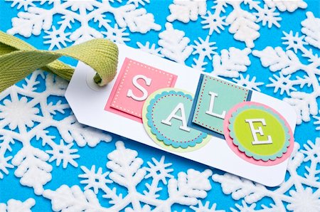 simsearch:400-04231102,k - Sale Tag on a Winter Holiday Snowflake Background. Fotografie stock - Microstock e Abbonamento, Codice: 400-04758930