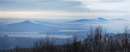 Panorama of snow-covered country situated below the ruins of an old castle Stock Photo - Budget Royalty-Free & Subscription, Code: 400-04758960