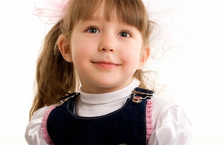 Beautiful little girl smiling over white Stockbilder - Microstock & Abonnement, Bildnummer: 400-04759636