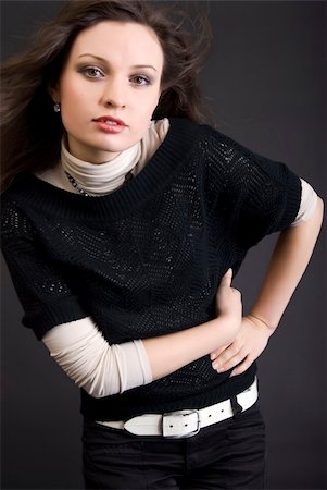 simsearch:400-04267059,k - Portrait of a young beautiful brunette over black Photographie de stock - Aubaine LD & Abonnement, Code: 400-04759639