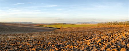 Panorama of landscape with blue sky above the plowed fields Stock Photo - Budget Royalty-Free & Subscription, Code: 400-04759898