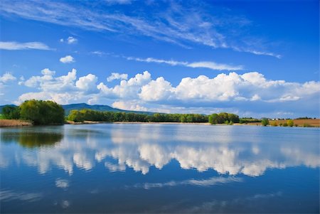 fishpond - Surreal water reflection of blue sky with clouds Stock Photo - Budget Royalty-Free & Subscription, Code: 400-04759904