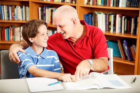 simsearch:400-08034926,k - Cute school boy gets help with his homework from Dad. Stock Photo - Budget Royalty-Free & Subscription, Code: 400-04750172