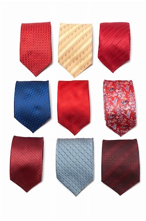 simsearch:400-08614028,k - Varicoloured male ties convolute on white background Stockbilder - Microstock & Abonnement, Bildnummer: 400-04750223