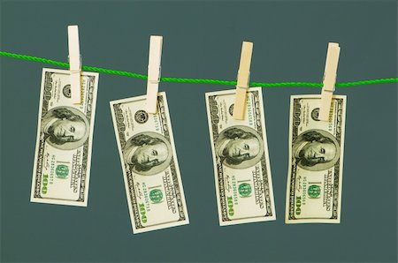 simsearch:693-06021294,k - Money laundering concept with dollars on the rope Stockbilder - Microstock & Abonnement, Bildnummer: 400-04750362