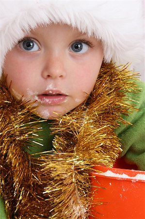 Toddler wearing a christmas hat, baking christmas cookies Stock Photo - Budget Royalty-Free & Subscription, Code: 400-04750381