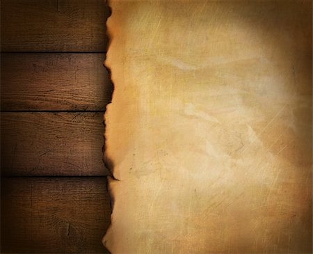 scrolled up paper - Closeup of parchment paper on wood background Stock Photo - Budget Royalty-Free & Subscription, Code: 400-04750680