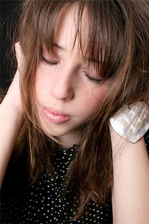 Close up of a teen model with closed eyes Stock Photo - Budget Royalty-Free & Subscription, Code: 400-04750790