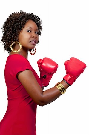 A beautiful young woman wearing a pair of boxing gloves Stock Photo - Budget Royalty-Free & Subscription, Code: 400-04750980