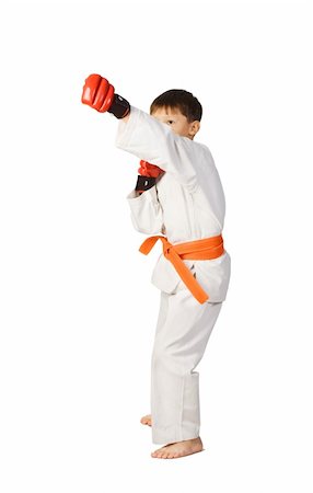 A young boy aikido fighter in white kimono showing Martial Art Stock Photo - Budget Royalty-Free & Subscription, Code: 400-04751078