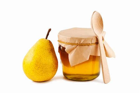 Honey in glass jar, pear, wooden spoon isolated on white background. Stockbilder - Microstock & Abonnement, Bildnummer: 400-04752046