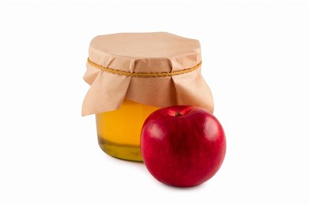 Honey, jar, wooden spoon, red apple isolated. Stockbilder - Microstock & Abonnement, Bildnummer: 400-04752047