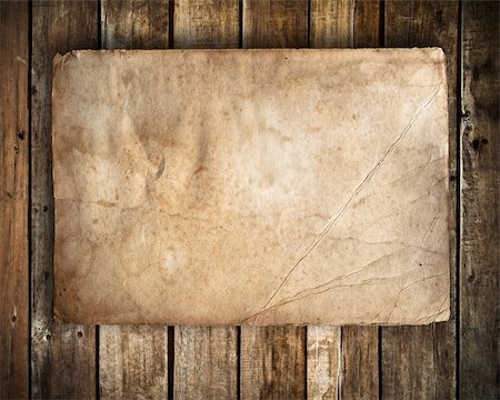 old paper on Grunge wood wall background Fotografie stock - Microstock e Abbonamento, Codice: 400-04752165