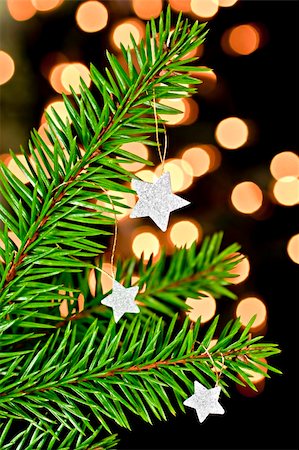 Fir branch with hanging Christmas decorations on a black background. Back background bokhe not photoshop. Fotografie stock - Microstock e Abbonamento, Codice: 400-04752668