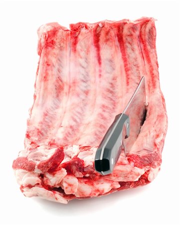 simsearch:400-07749007,k - meat cleaver in rib isolated on a white background. Foto de stock - Royalty-Free Super Valor e Assinatura, Número: 400-04753385