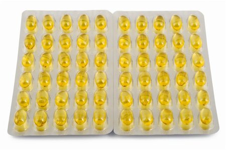 yellow capsules with fish oil isolated on white background Stock Photo - Budget Royalty-Free & Subscription, Code: 400-04753434