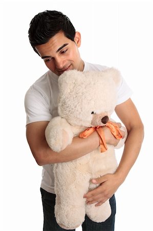 furry teddy bear - A man cuddling a teddy bear.  White background. Stock Photo - Budget Royalty-Free & Subscription, Code: 400-04753831
