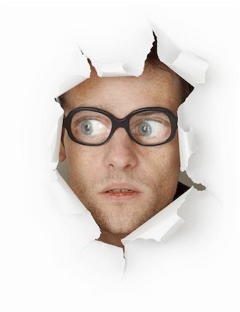 shocked face animal - Funny man in an old-fashioned glasses looking out of the hole isolated on white background Stock Photo - Budget Royalty-Free & Subscription, Code: 400-04764426
