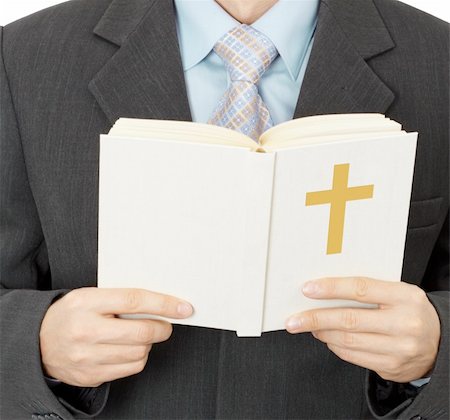 A man reads the Catholic Bible - closeup Foto de stock - Super Valor sin royalties y Suscripción, Código: 400-04764436