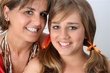 simsearch:400-04747810,k - Beautiful mother and daughter on a white background Stock Photo - Budget Royalty-Free & Subscription, Code: 400-04764659