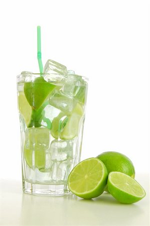 simsearch:400-04787910,k - Caipirinha cocktail with green lemon and ice cubes Stock Photo - Budget Royalty-Free & Subscription, Code: 400-04764804